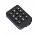 Black plastic digital keypad remote with rubber buttons, numbered 0-9, and status indicator lights.