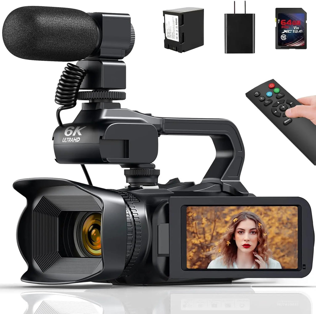 Black 6K video camera with shotgun microphone, remote, battery, charger, and memory card on a white background.