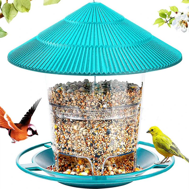 Teal, pagoda-style bird feeder with a clear, seed-filled reservoir and a perch tray, surrounded by small birds.