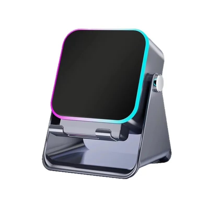 Dark grey wireless induction speaker and phone stand with a sleek, adjustable design and colourful glowing light trim.