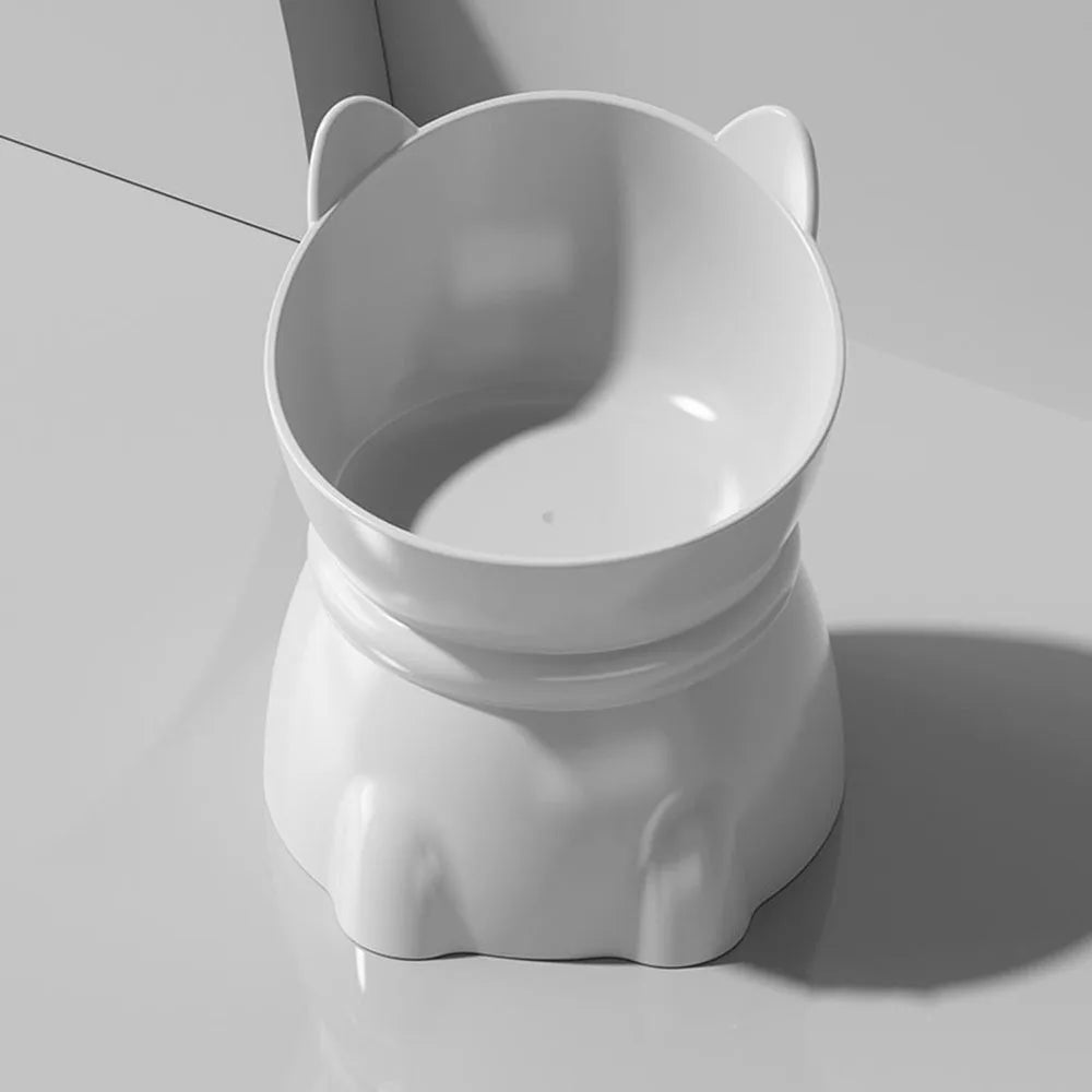 White, elevated cat feeding bowl with cute ears, designed for ergonomic neck support.
