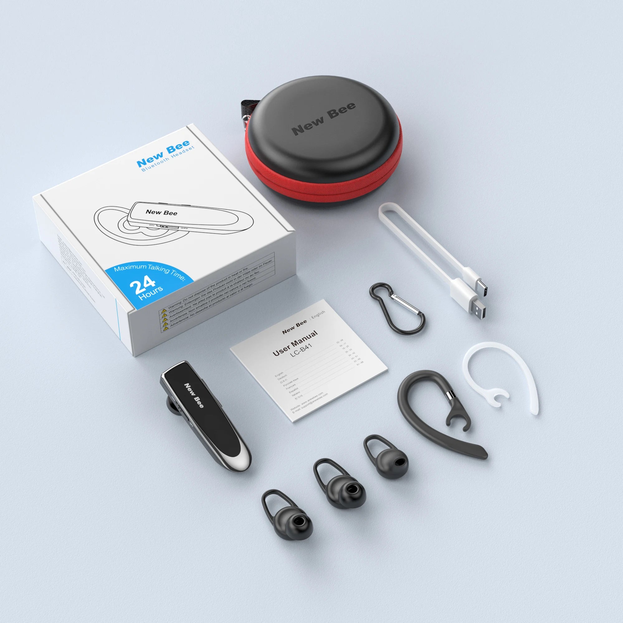 Wireless hands-free Bluetooth headset with microphone, charging cable, carry case, and assorted silicone ear tips.
