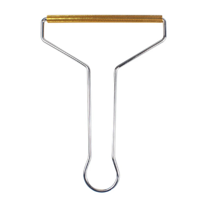Metal lint remover tool with a shiny silver wire handle and a textured gold-toned cleaning bar.