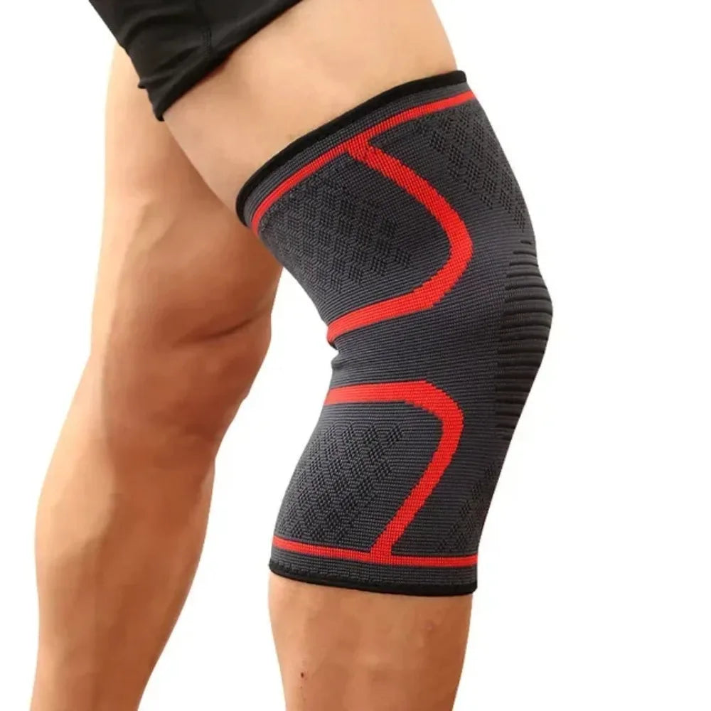 Gray elastic knee support brace with red accent lines worn on a bent leg.