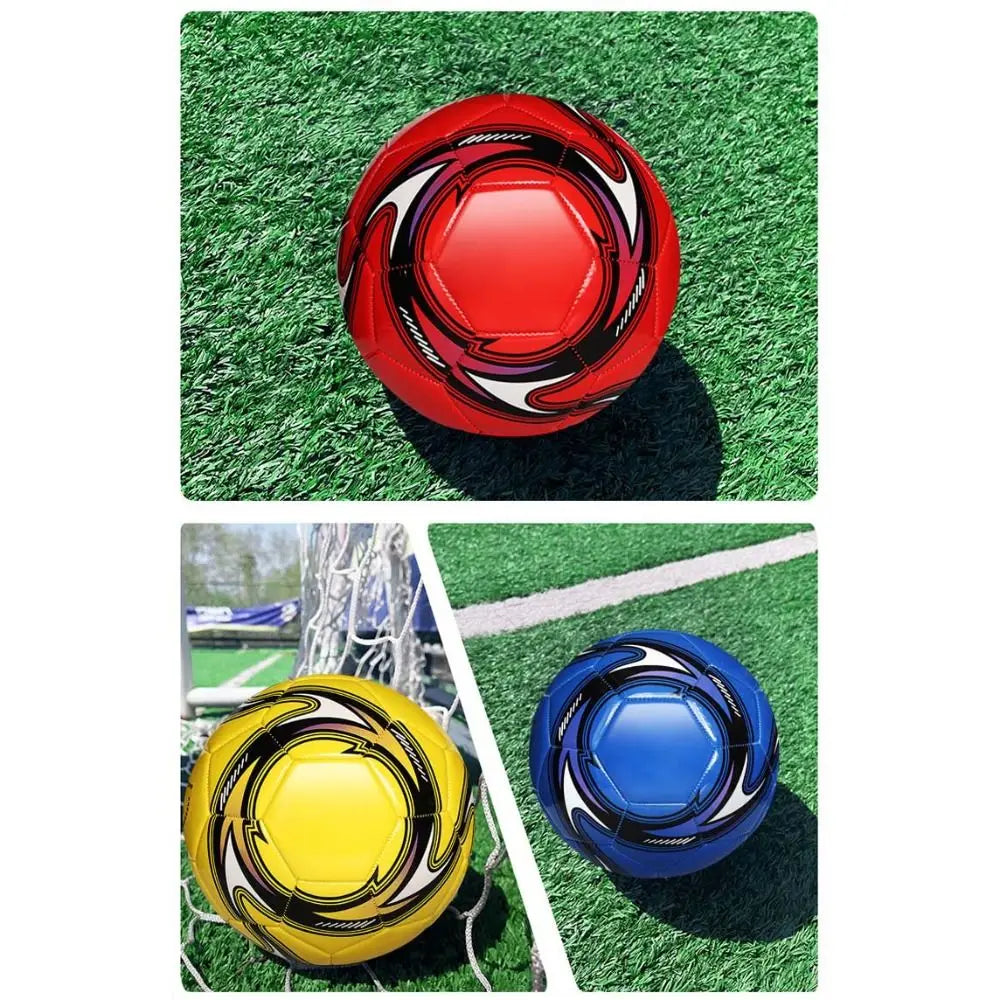 Three footballs in red, yellow, and blue, featuring a modern, sleek graphic pattern, displayed on artificial turf.