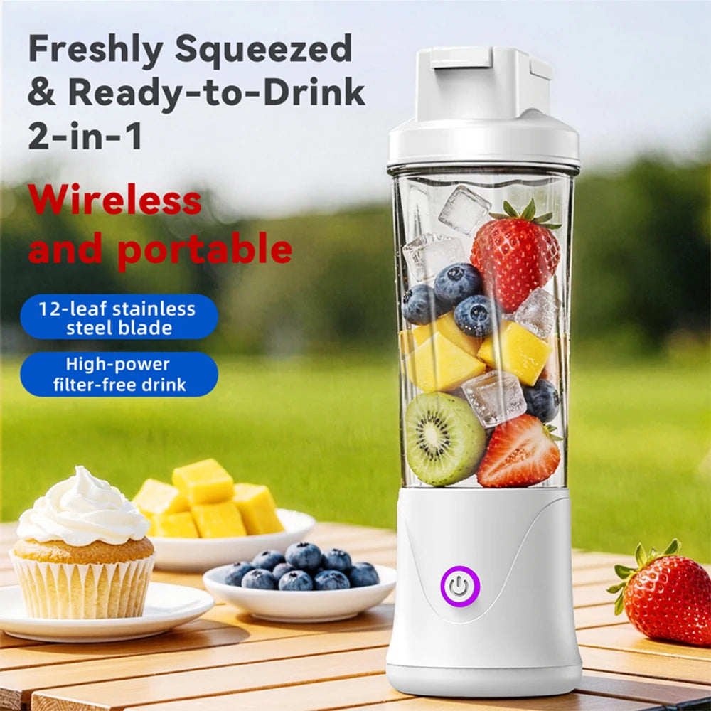 Portable white wireless blender filled with fresh fruit and ice, shown on an outdoor table with a cupcake nearby.