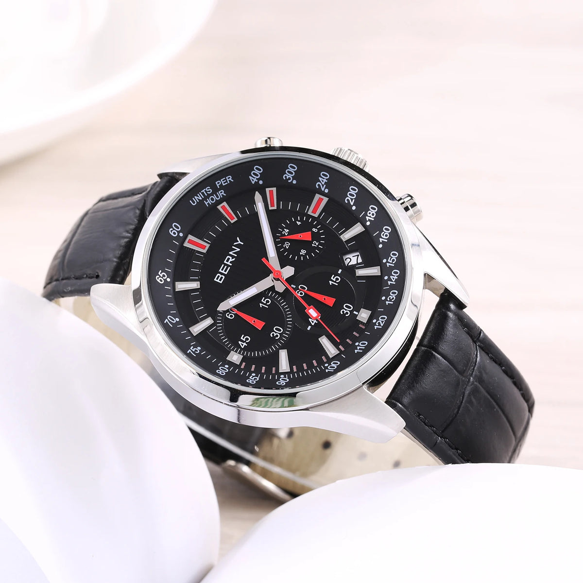 BERNY men's chronograph watch with a black dial, silver case, red accents, and black leather strap.