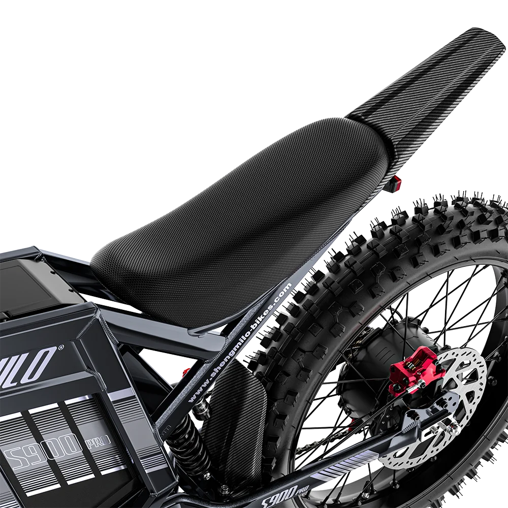 Black Shengmilo S900 Pro electric bike showing long padded seat, carbon-fiber fender, and knobby rear tire.