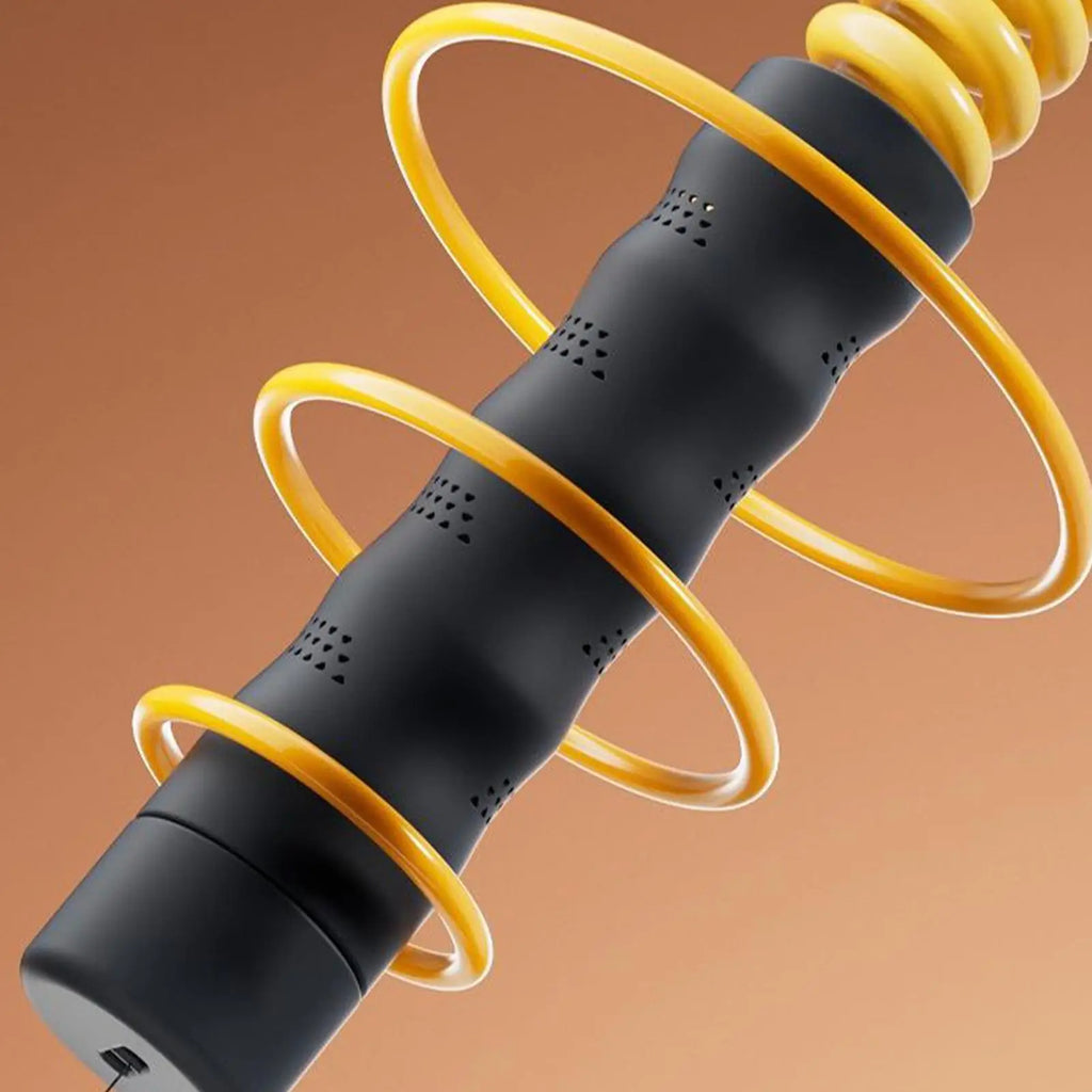 Close-up of a black, textured fitness handle wrapped in a yellow, coiled weighted resistance cable.