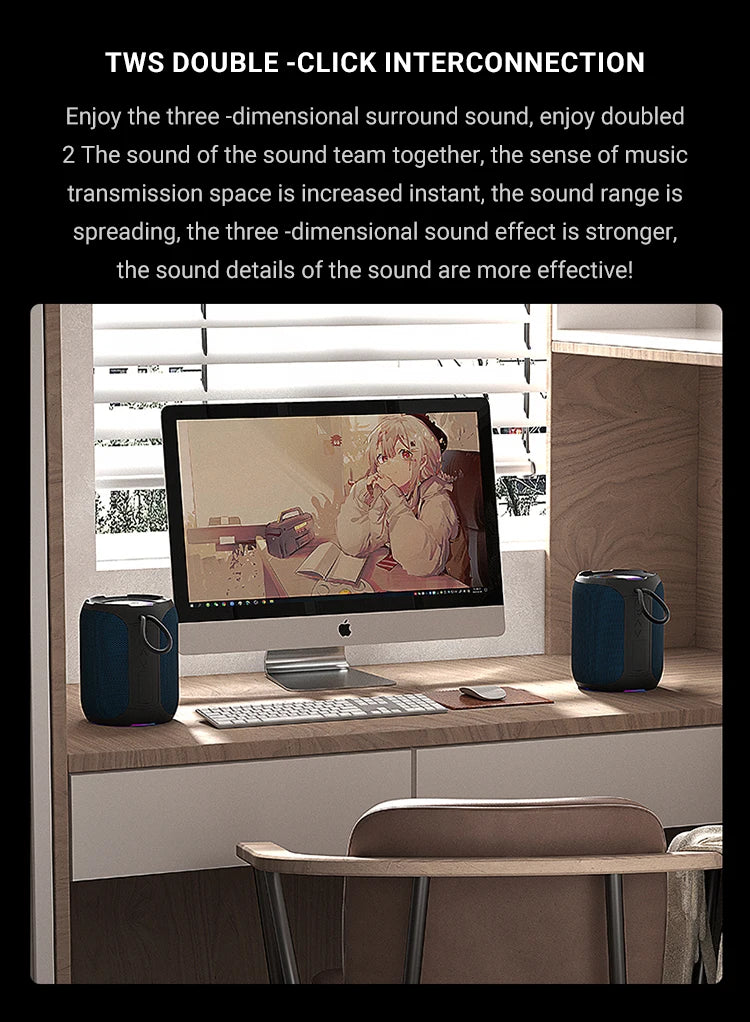Two blue, portable cylindrical Bluetooth speakers placed on a wooden desk, one on each side of a computer monitor.
