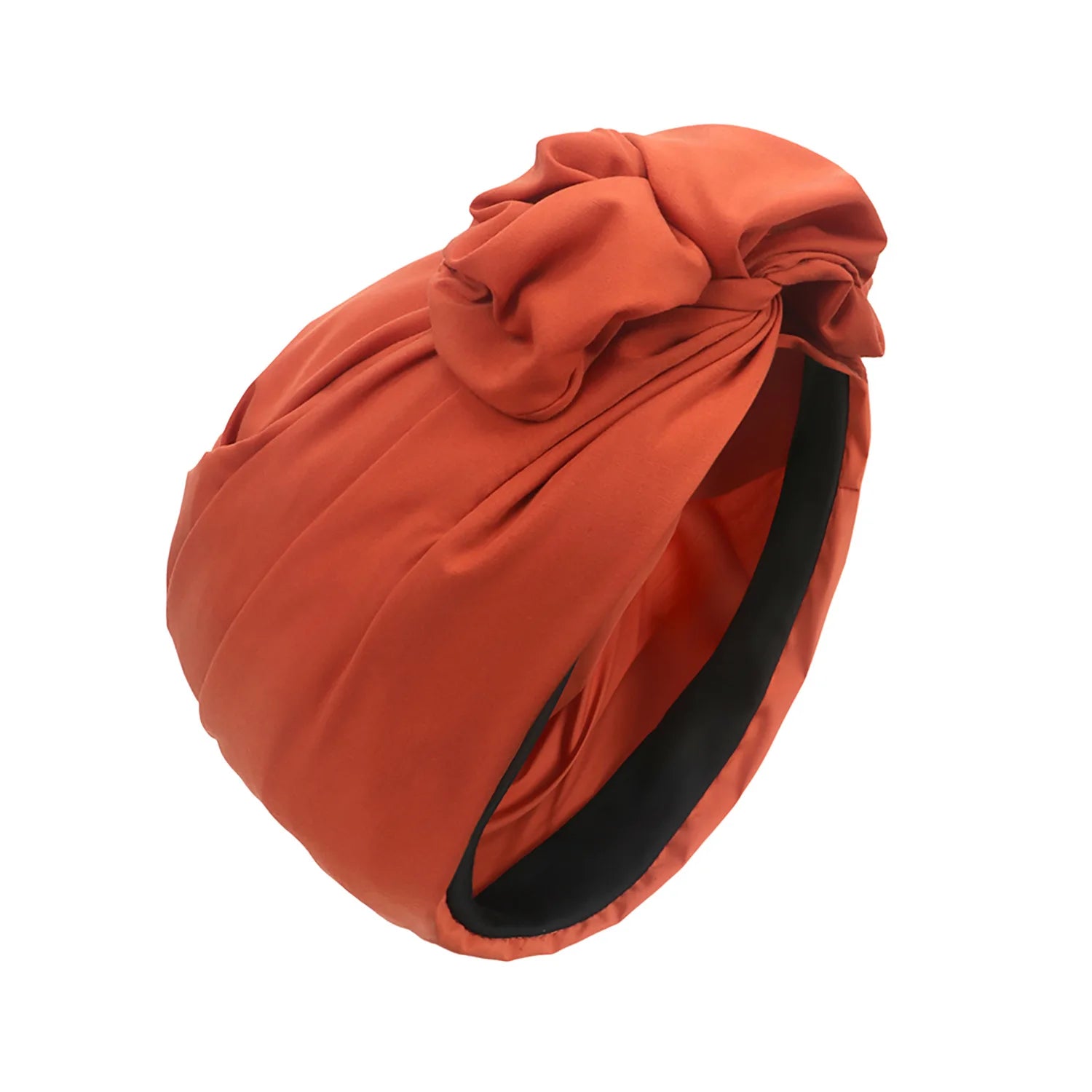 Rust-orange vintage-style knotted turban hat with a smooth finish and black inner lining.