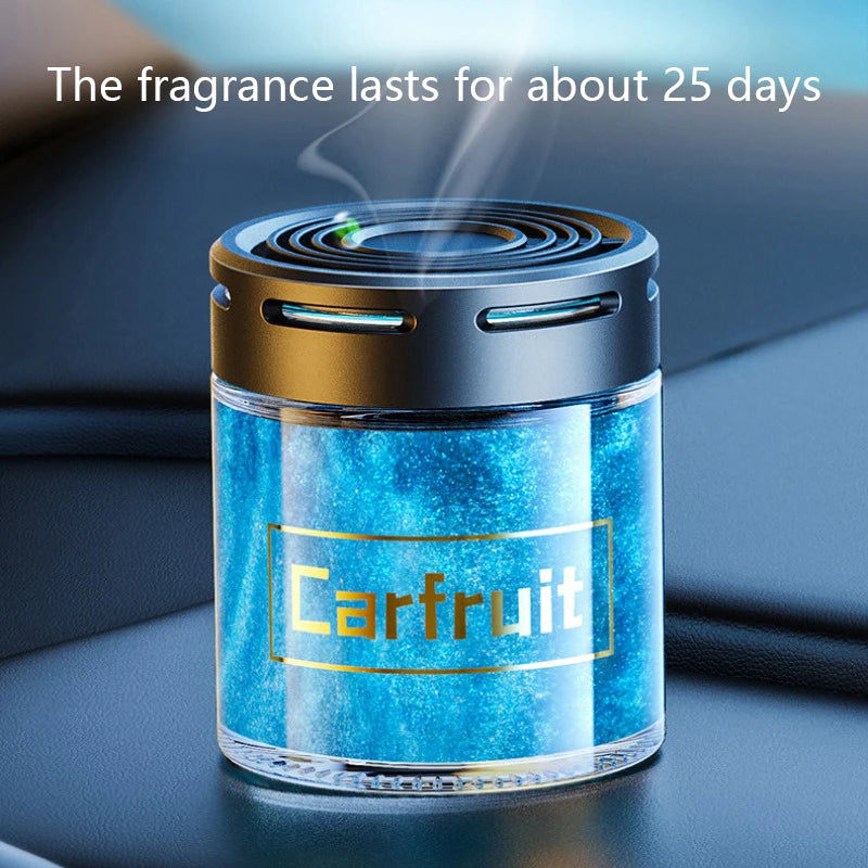 Cylindrical car air freshener with a black lid and a blue glitter gel refill, emitting a fragrant mist.