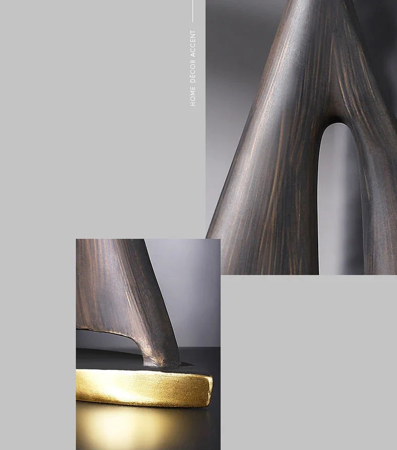 Abstract resin sailboat ornament with a dark brown, wood-grain texture and a contrasting gold-finished base.