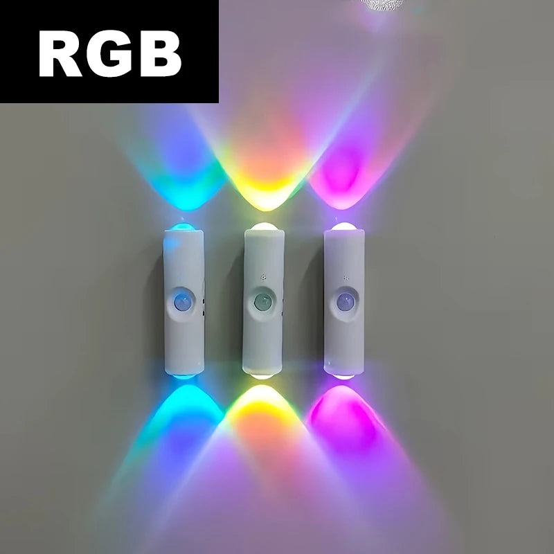 Three white, rechargeable LED wall lights with motion sensors, each casting vibrant, multi-coloured light patterns.