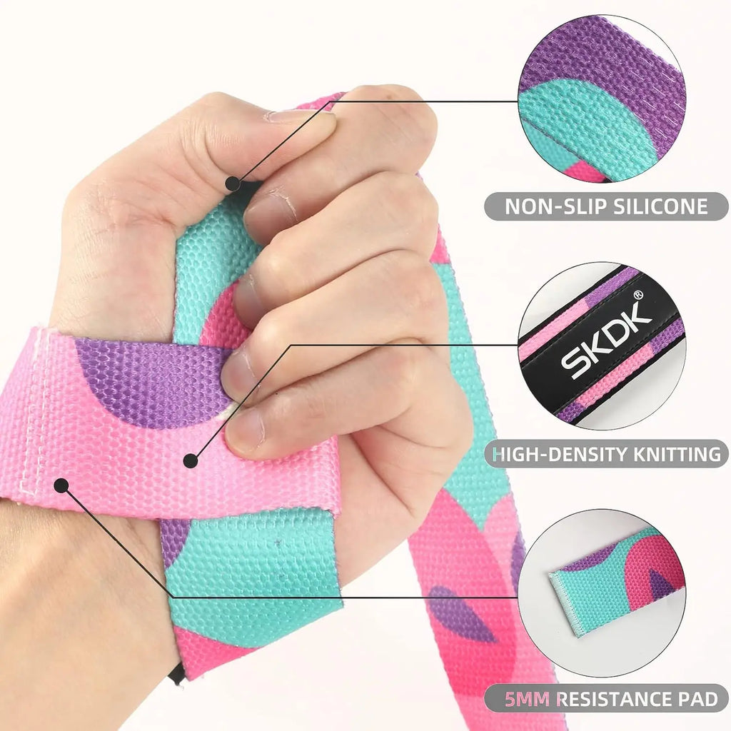 Hand wearing a pink, purple, and turquoise weightlifting strap with non-slip silicone, knitted fabric, and foam pad.