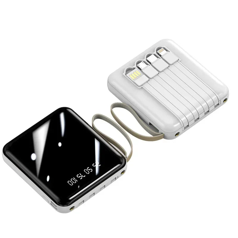 Compact white and black portable power banks with built-in charging cables and a digital battery percentage display.