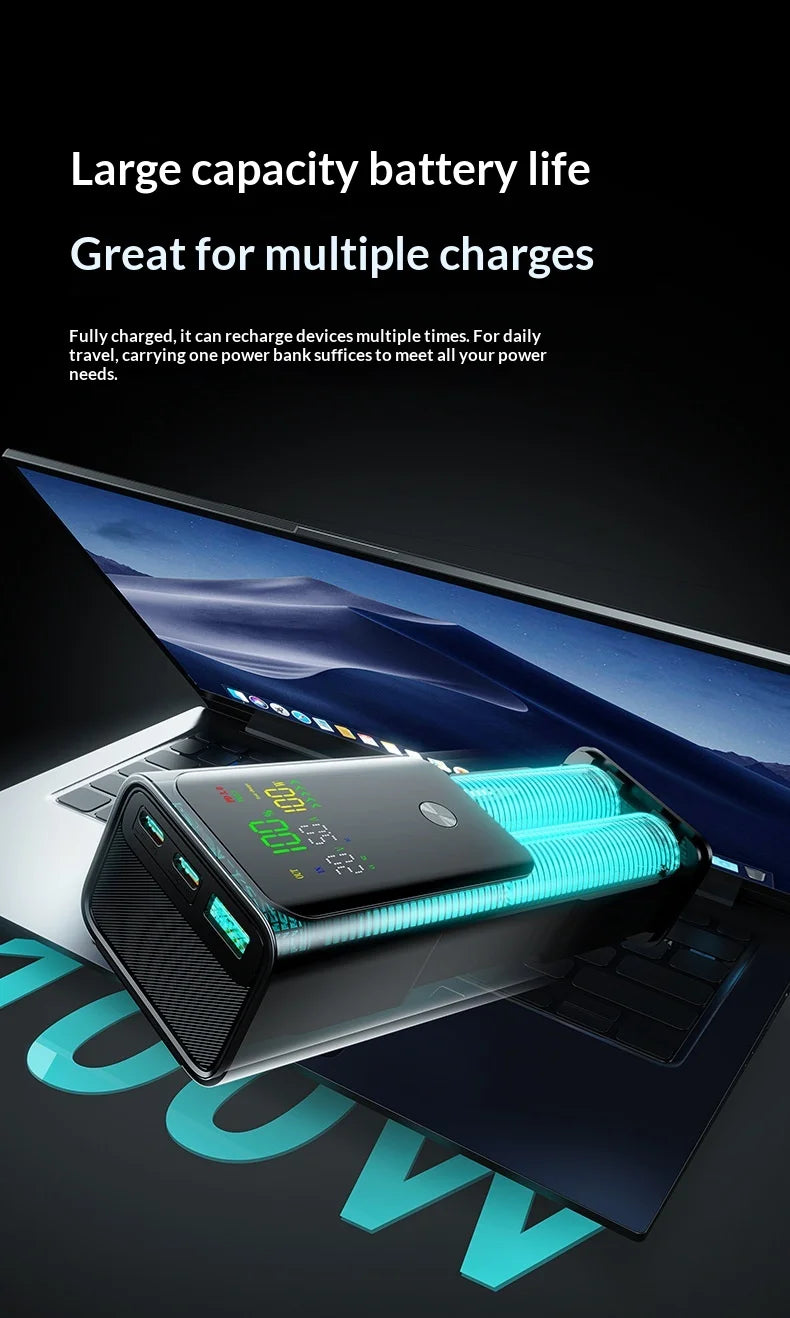 Black high-capacity power bank with digital display, glowing blue internal battery cells, and multiple charging ports.