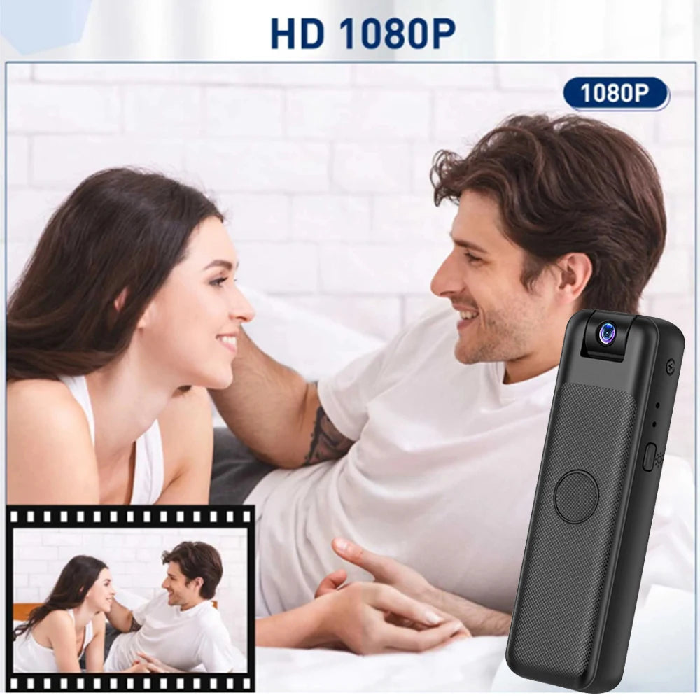 Small black plastic portable body camera with a 1080p lens, textured grip, and a central record button.