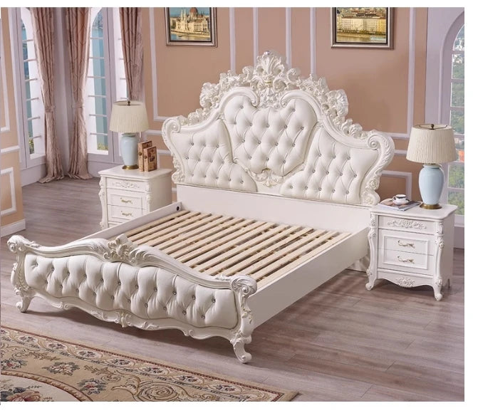 Luxury cream bed with an ornate, button-tufted headboard, elegant carved details, and two matching bedside tables.