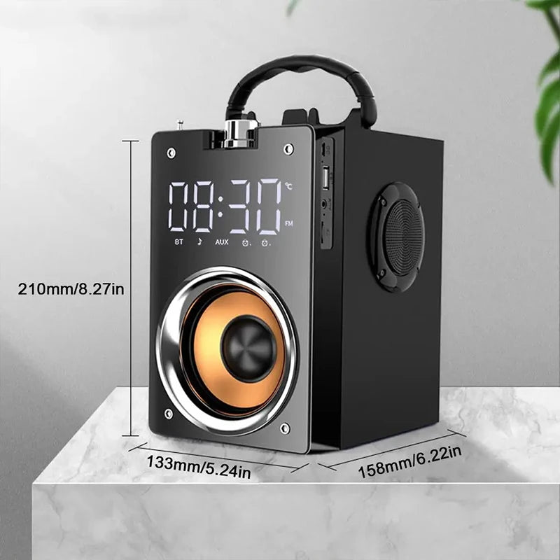 Portable black wireless speaker with a carry handle, copper-coloured driver, digital display, and side-mounted controls.