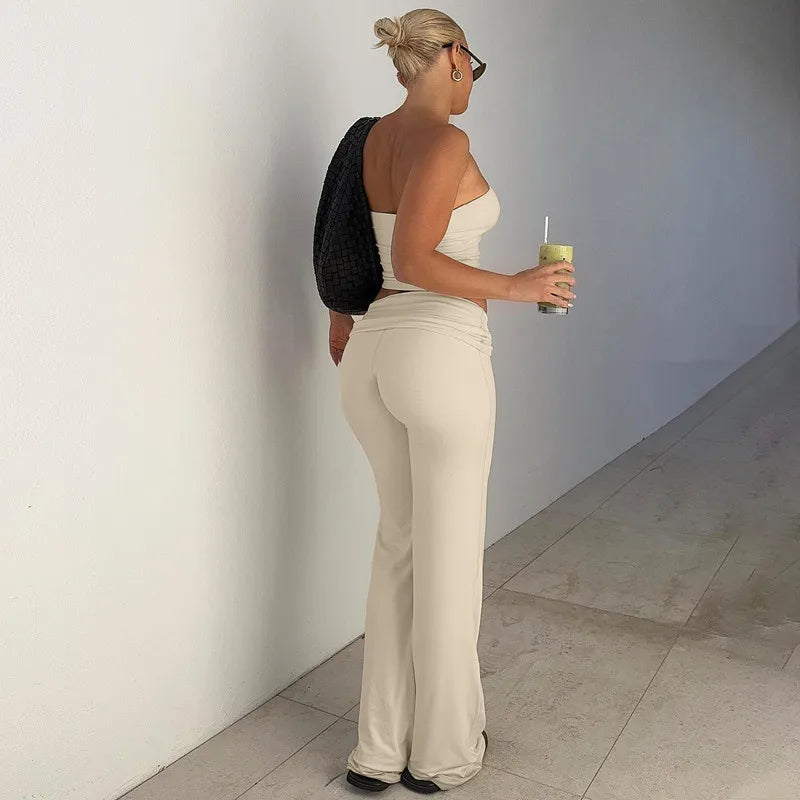 Cream co-ord set featuring a strapless crop top and matching low-rise flared trousers.