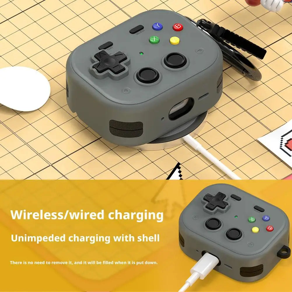 Grey silicone retro games controller case for AirPods, featuring colourful buttons and support for wireless charging.