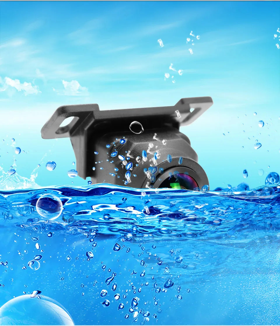 Black vehicle reversing camera with a wide-angle lens, partially submerged in water to highlight its waterproof design.