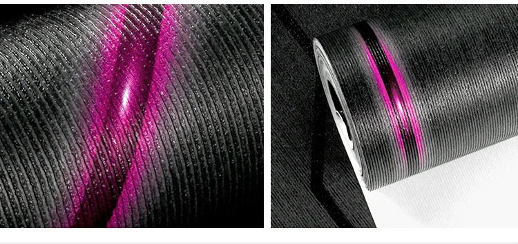 Modern black ribbed wallpaper roll with a shimmering pink reflective 3D stripe effect.