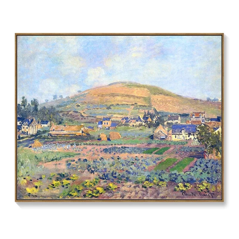 Impressionist landscape art print in a slim wooden frame, featuring a colourful village scene with a large hill.