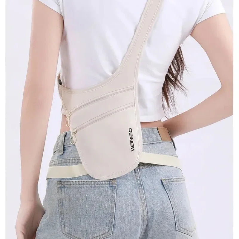 Beige anti-theft crossbody travel pouch with secure zip pockets, worn across the chest for safety.