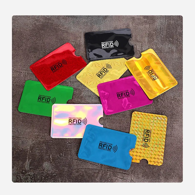 Assorted rectangular RFID-blocking card sleeves in various metallic, holographic, and solid colors.