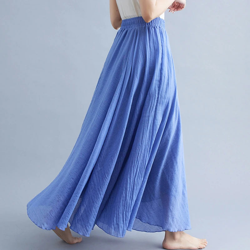 Flowing cornflower blue maxi skirt with an elasticated waistband and textured, lightweight fabric.