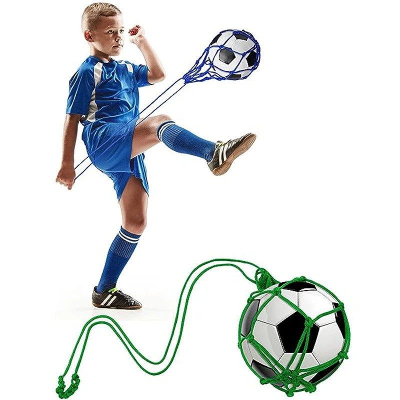 Young boy practicing soccer skills with a ball attached to an adjustable elastic cord for solo training.