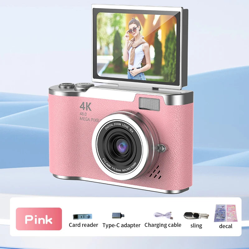 Pink 4K digital camera with leather-textured body, flip-up screen, 18x zoom lens, and included accessories.