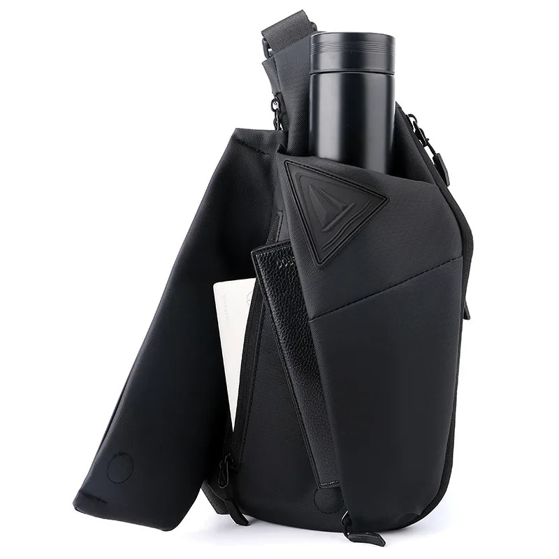 Black anti-theft crossbody sling bag with a secure bottle holder, zipped compartments and adjustable shoulder strap.