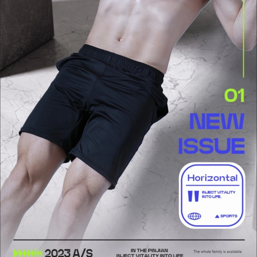 A model wearing plain black men’s sports shorts with an elasticated waistband, shown in an active studio setting.