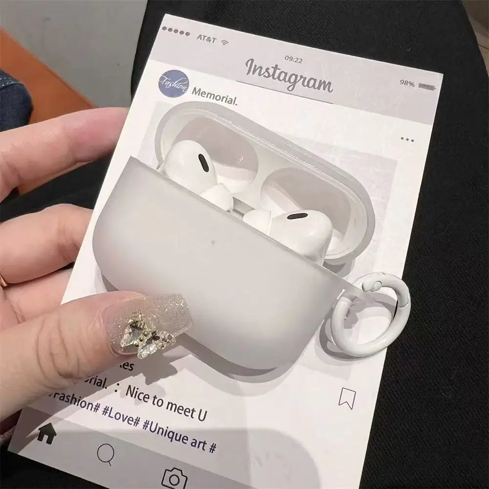 Matte white silicone protective case for AirPods Pro, featuring a side carabiner attachment.