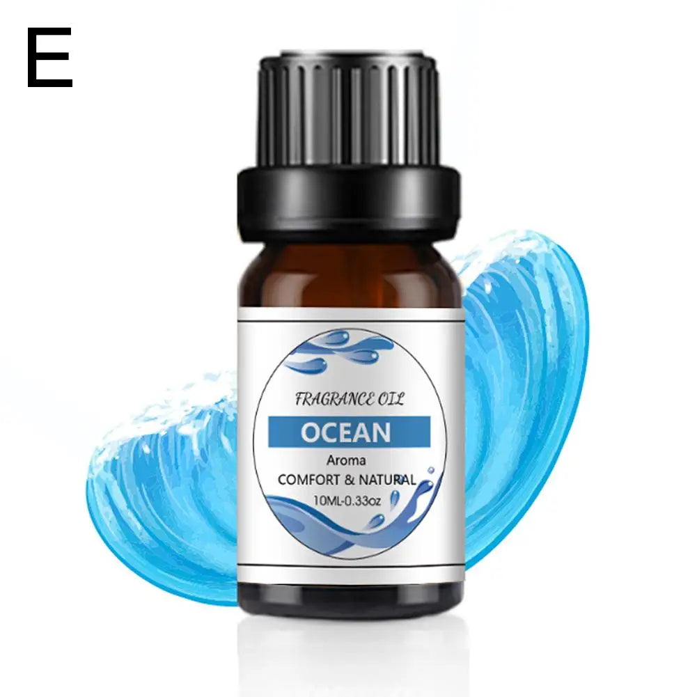 10ml amber glass bottle of Ocean fragrance oil with a black dropper cap, featuring a blue wave-themed label.