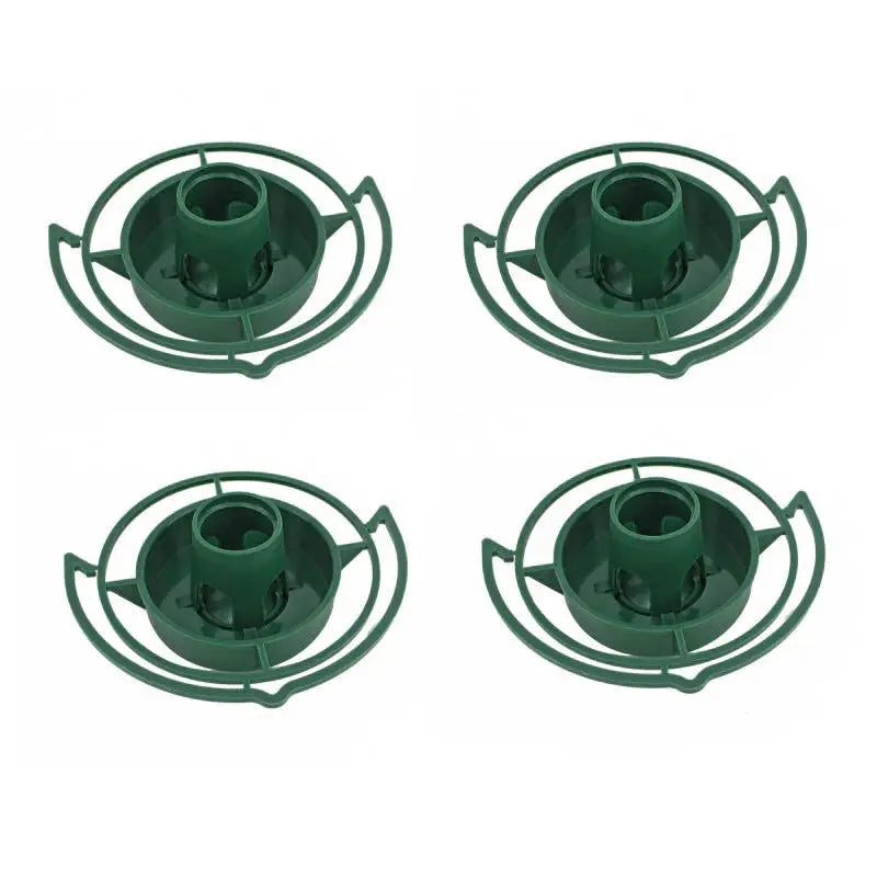 Four circular green plastic floral foam cages with a center stem holder for flower arrangements.