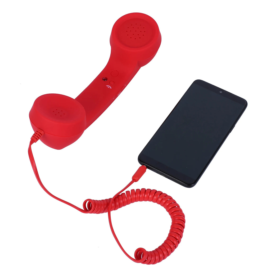 Bright red retro-style telephone handset with a coiled cable, plugged into a black smartphone.