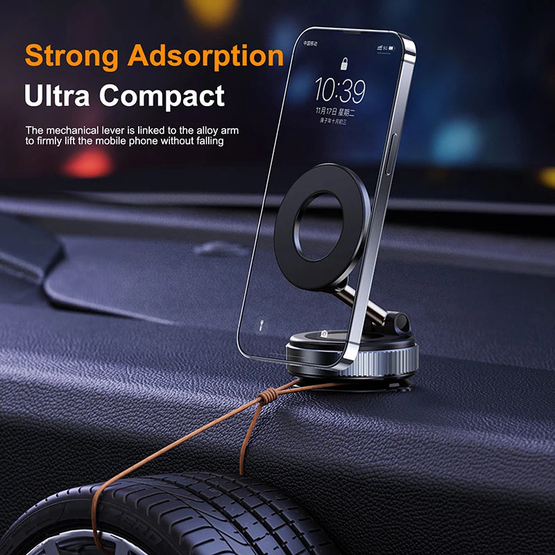 Compact magnetic car phone mount with a black circular holder and silver mechanical alloy arm on a car dashboard.