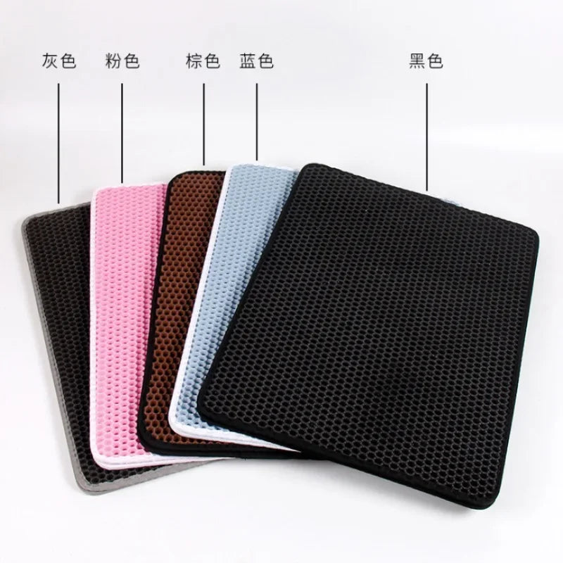 Five rectangular, double-layered waterproof cat litter mats with a honeycomb design, shown in grey, pink, brown, blue.