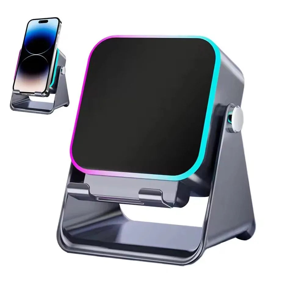 Dark grey portable Bluetooth speaker with integrated phone stand and vibrant RGB light ring.