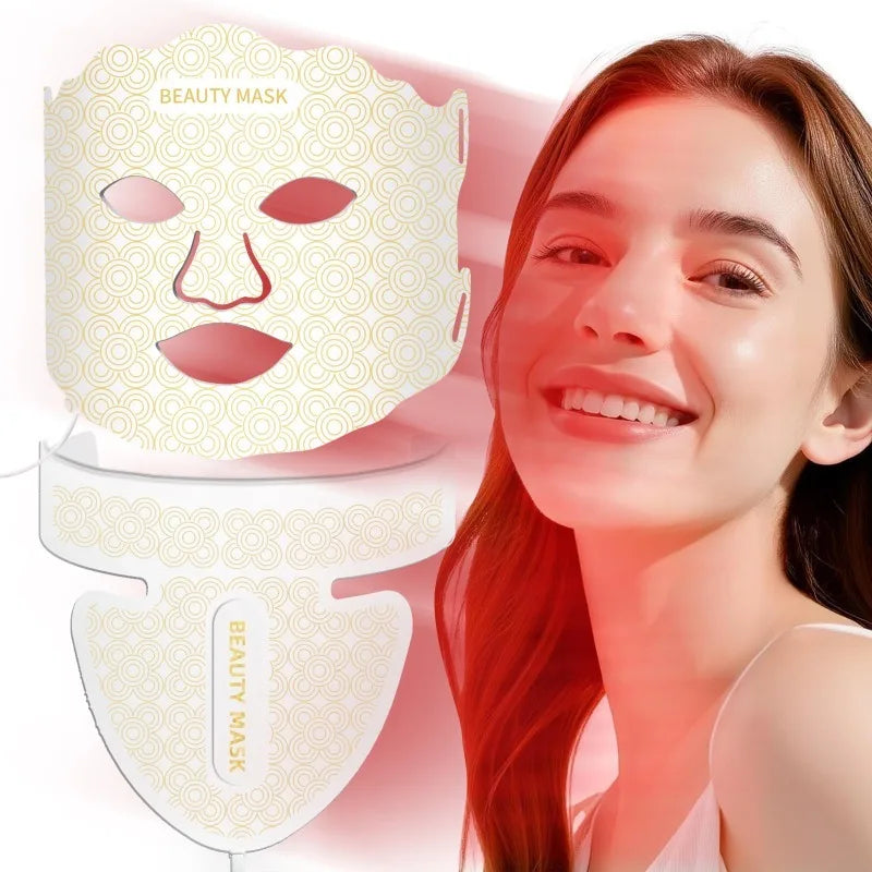 A smiling woman next to a white and gold patterned LED face and neck mask.