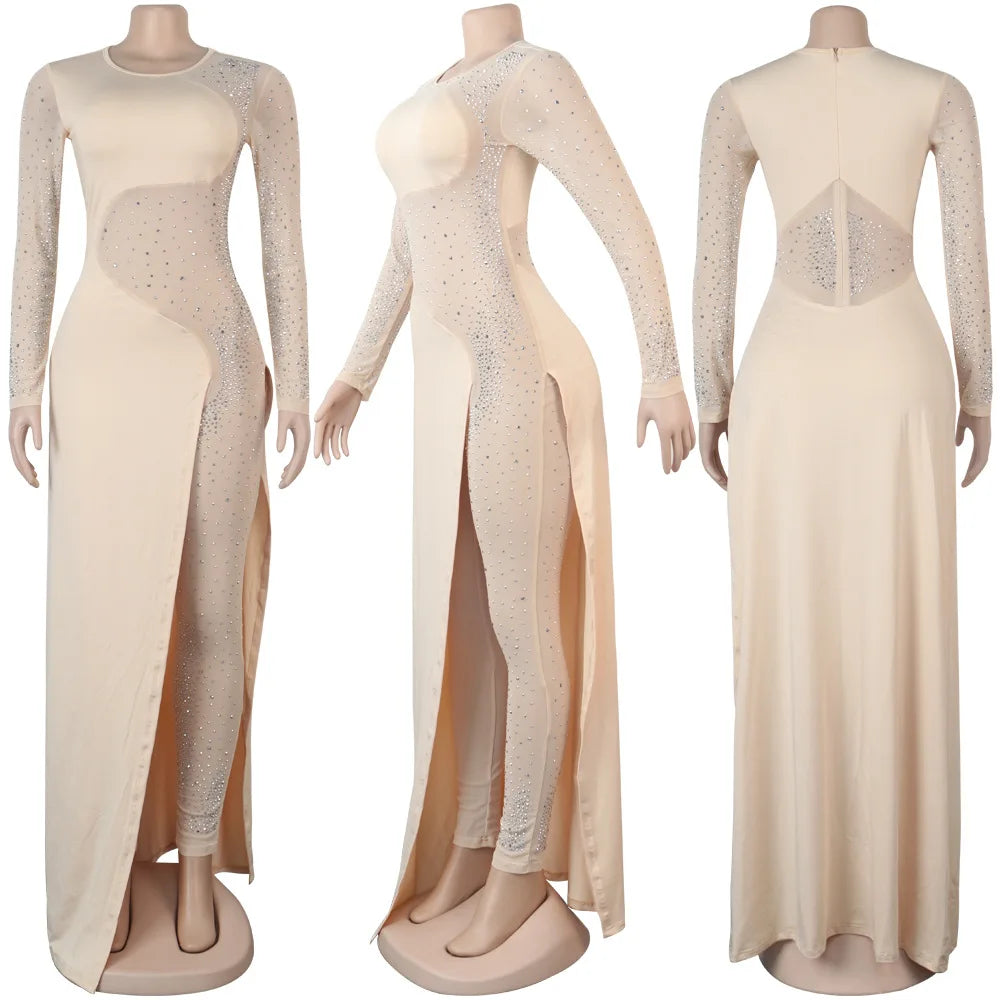 Nude long-sleeve mesh patchwork jumpsuit featuring rhinestone embellishments and an asymmetrical split skirt overlay.