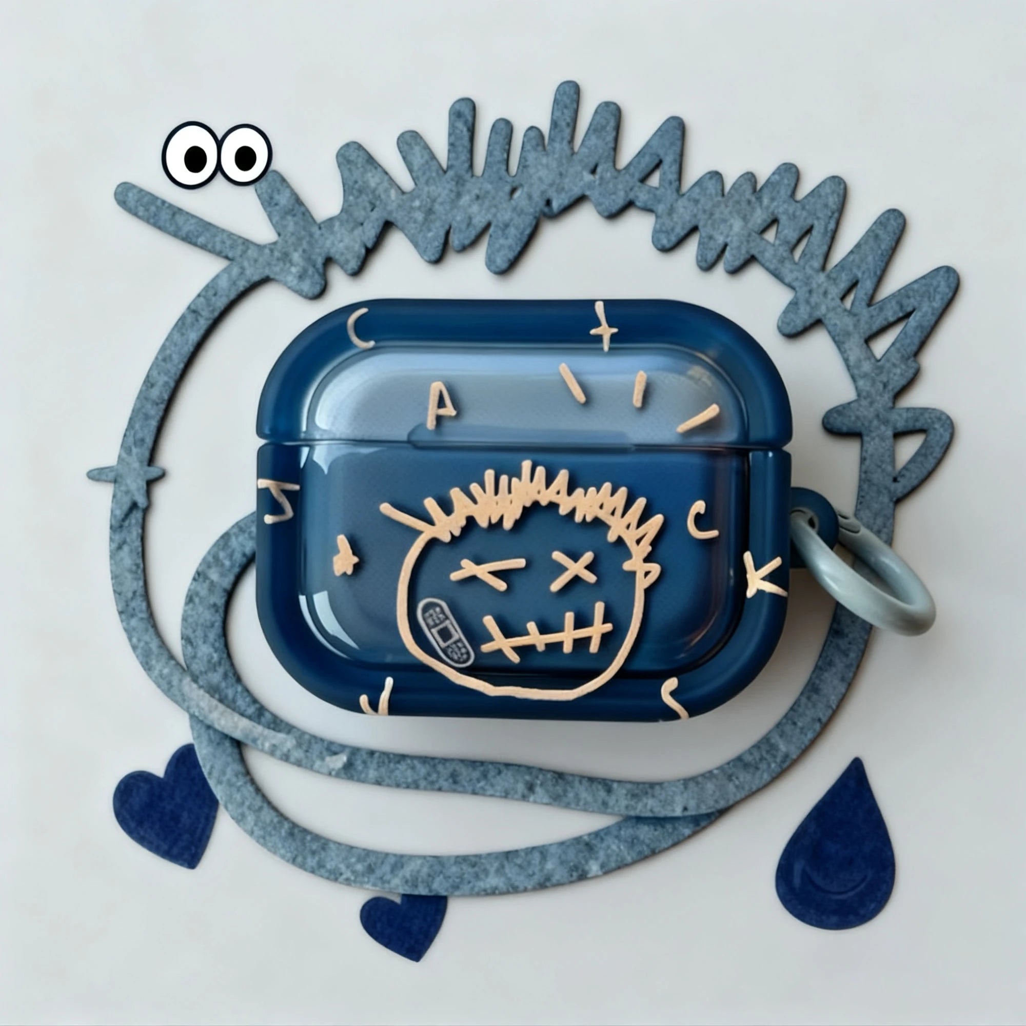 Navy blue silicone AirPods Pro case with a beige graphic 'Jack' face design and cartoon style decorations.