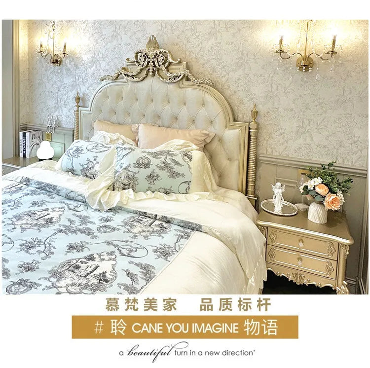 Cream Italian-style double bed with an ornate, button-tufted headboard, decorative gold detailing and carved pillars.