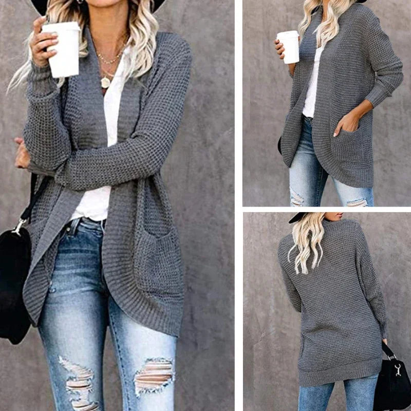 Gray open-front knitted cardigan sweater with long sleeves, ribbed trim, and front patch pockets.