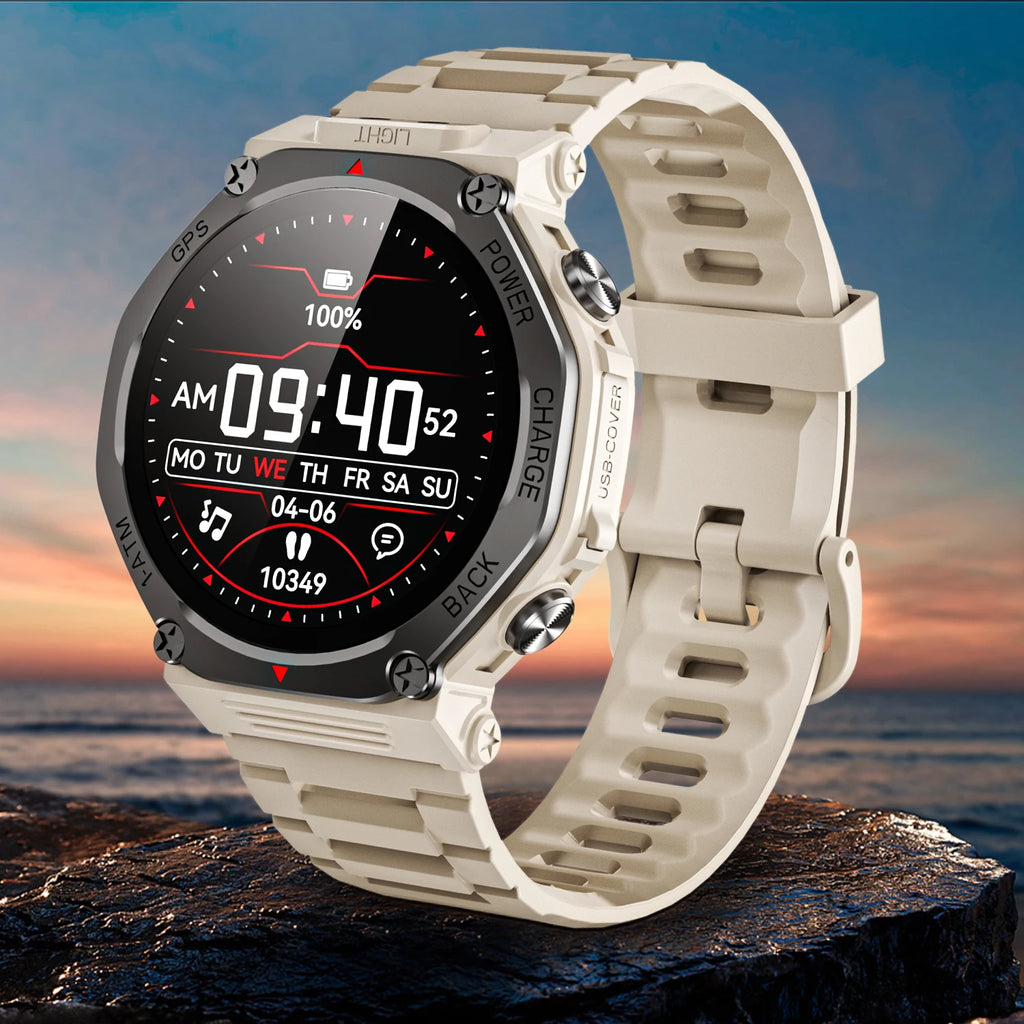 Rugged beige smartwatch with a digital display, integrated flashlight, and textured silicone strap against a sunset sea.