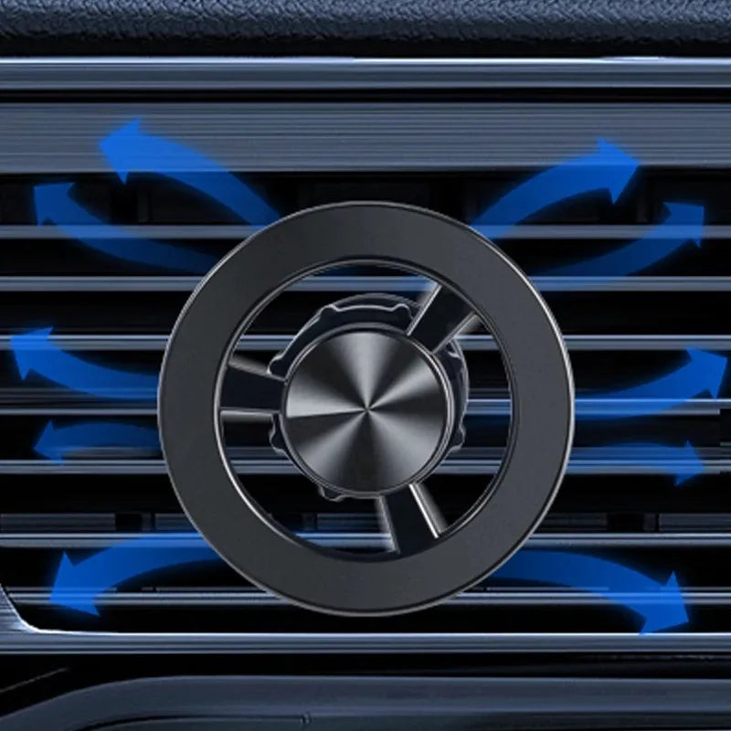 Black metallic car air vent freshener clip with a circular, propeller-inspired design.